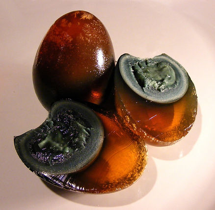 amber colored egg with grey yolk