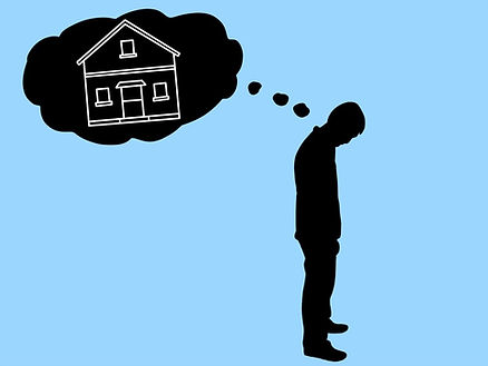 male figure thinking of home with blue background