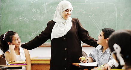 Female teacher in Arabic classroom with students