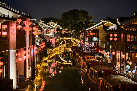 River at night lit by colorful lanterns